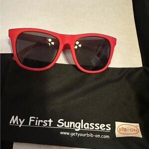 Vibrant Red Sunglasses with Dark Lenses for babies.